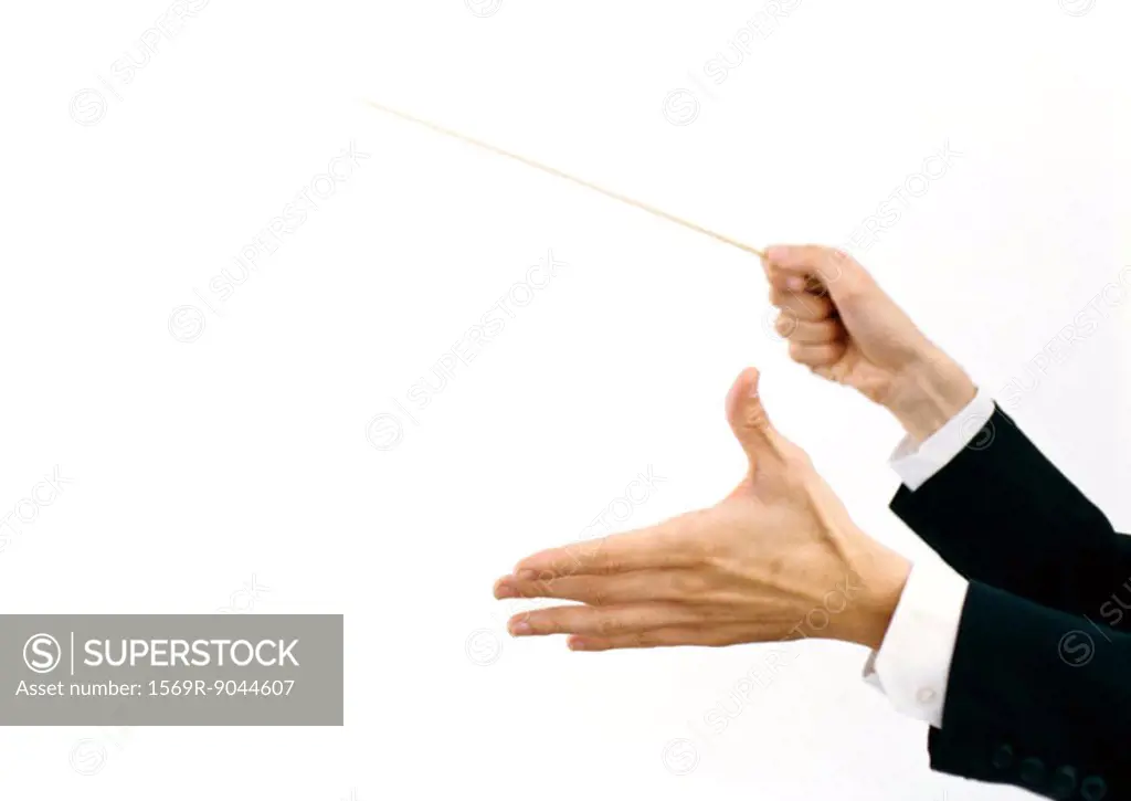 Conductor´s hands holding baton