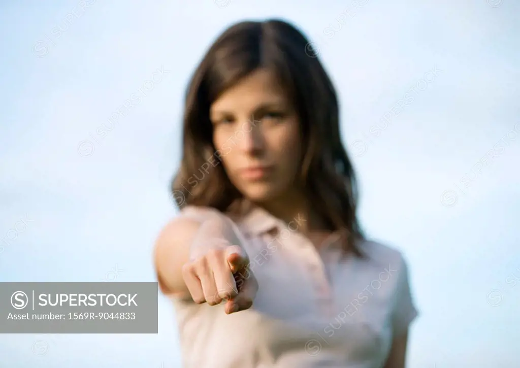 Woman pointing at camera
