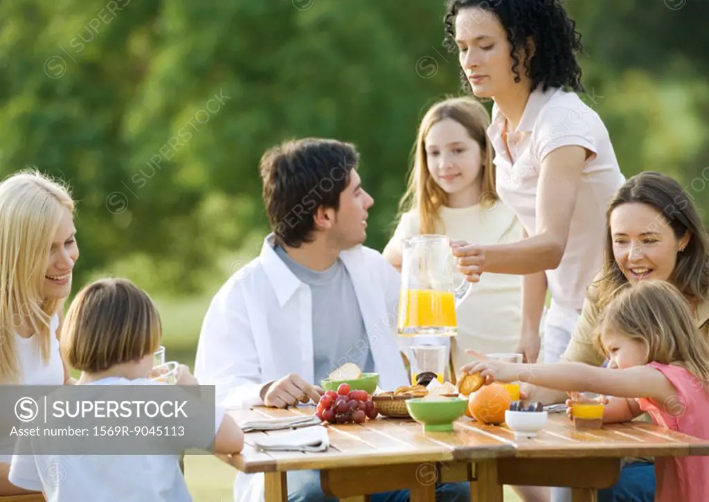 Group having breakfast outdoors
