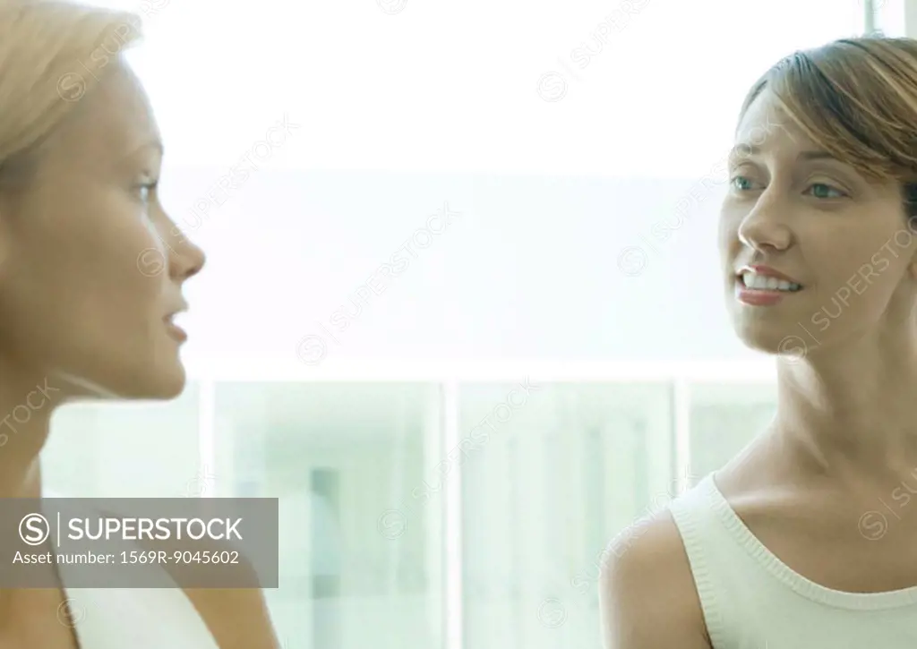 Two women speaking to each other