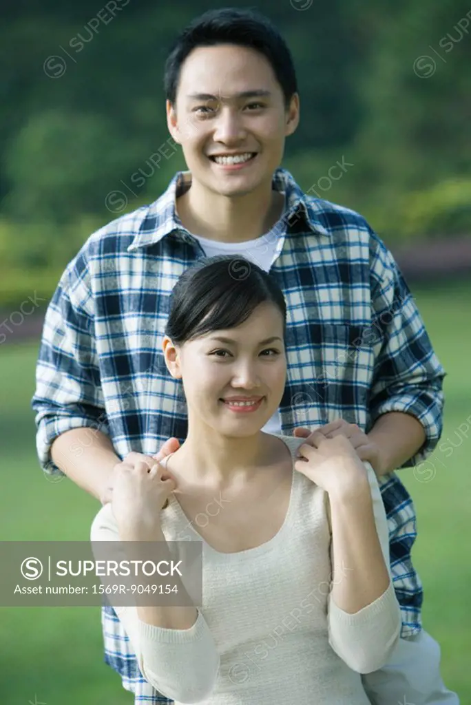 Couple, man with hands on woman´s shoulders, portrait
