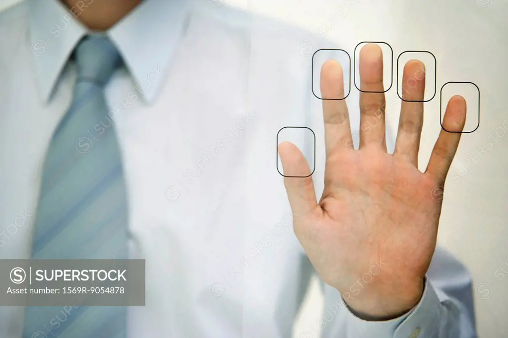 Man pressing fingertips to fingerprint reader