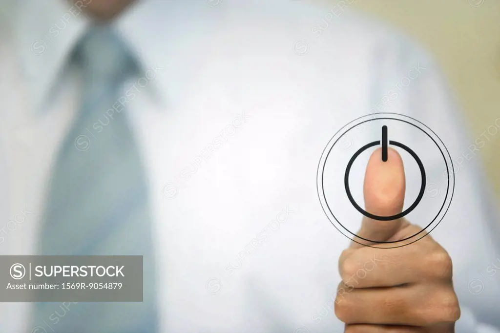 Man pressing thumb to power button