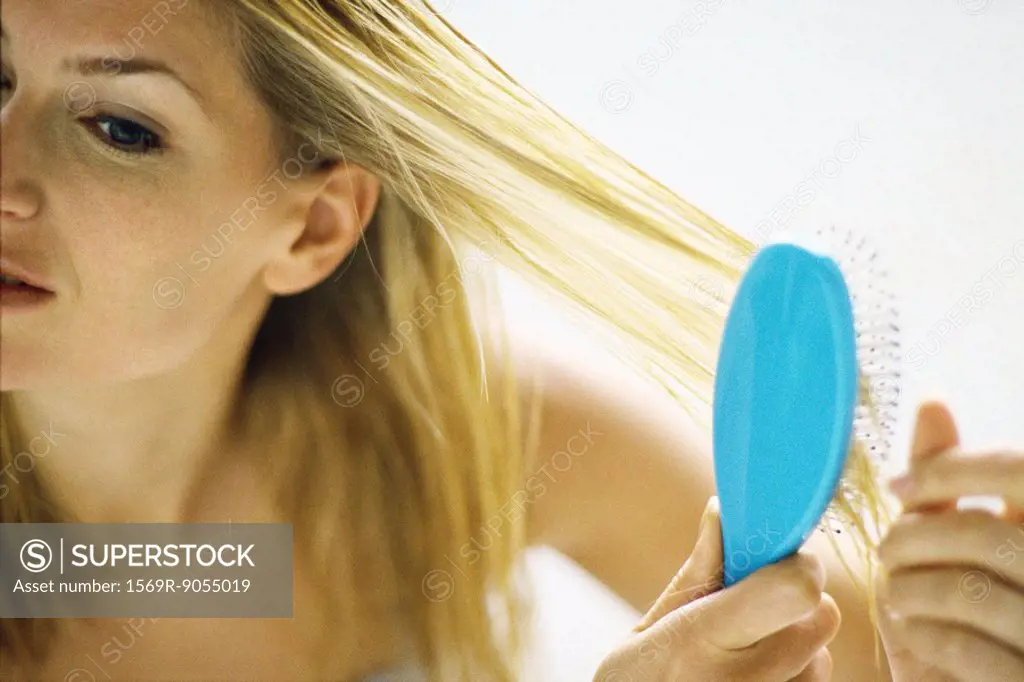 Woman brushing hair
