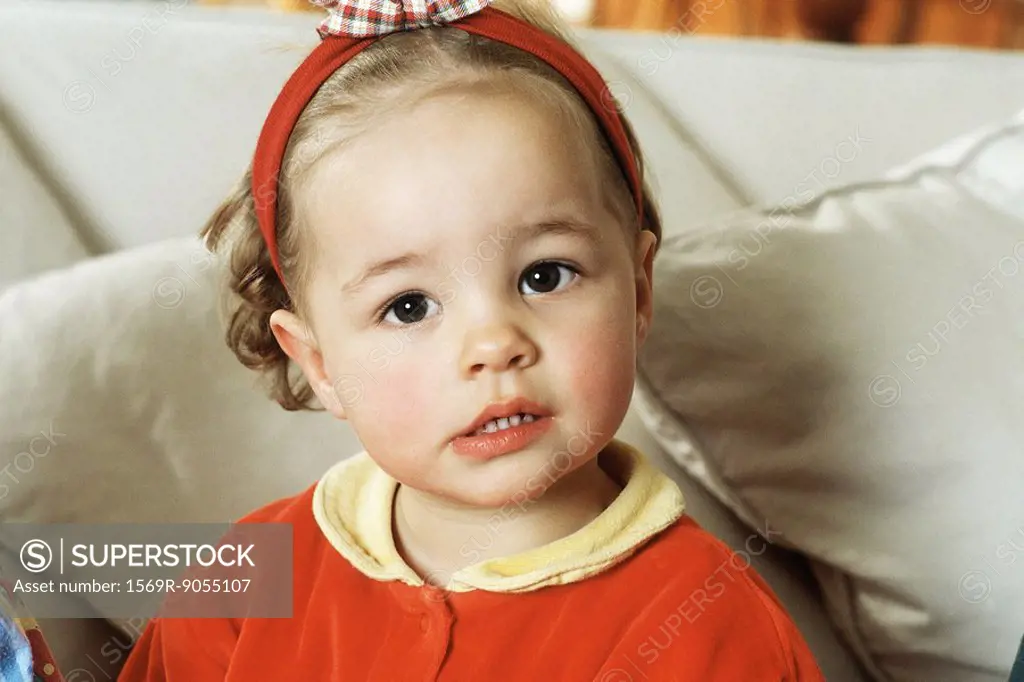 Little girl looking at camera, portrait