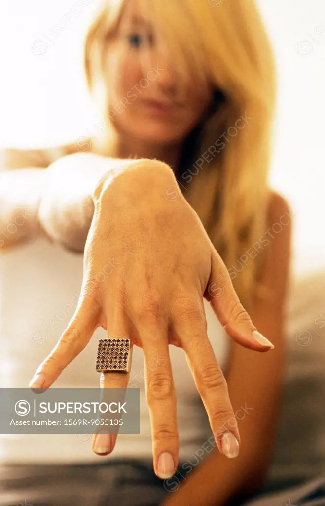 Woman showing ring to camera