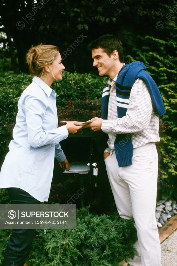 Couple checking mail together