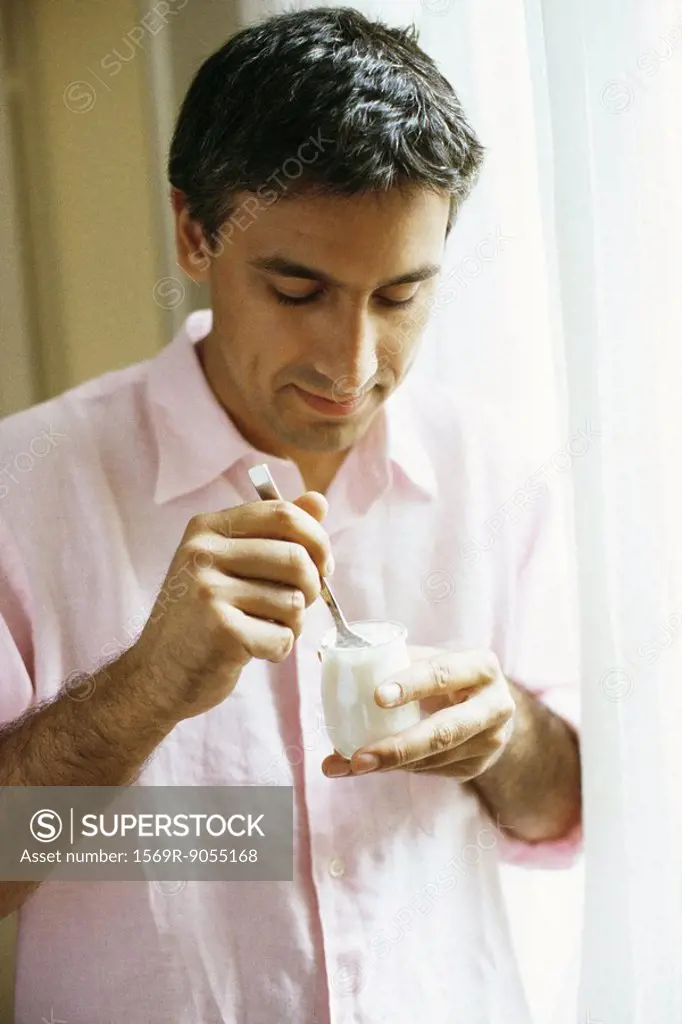 Man eating yogurt