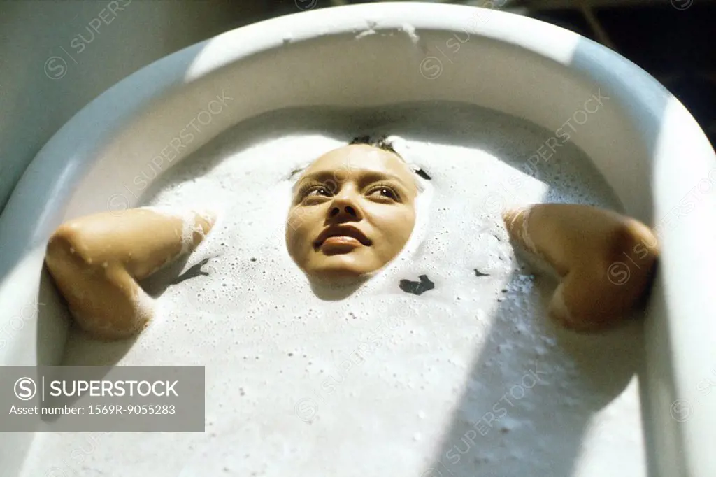 Woman soaking in bathtub