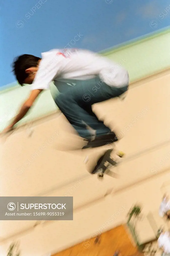 Skateboarder doing midair trick