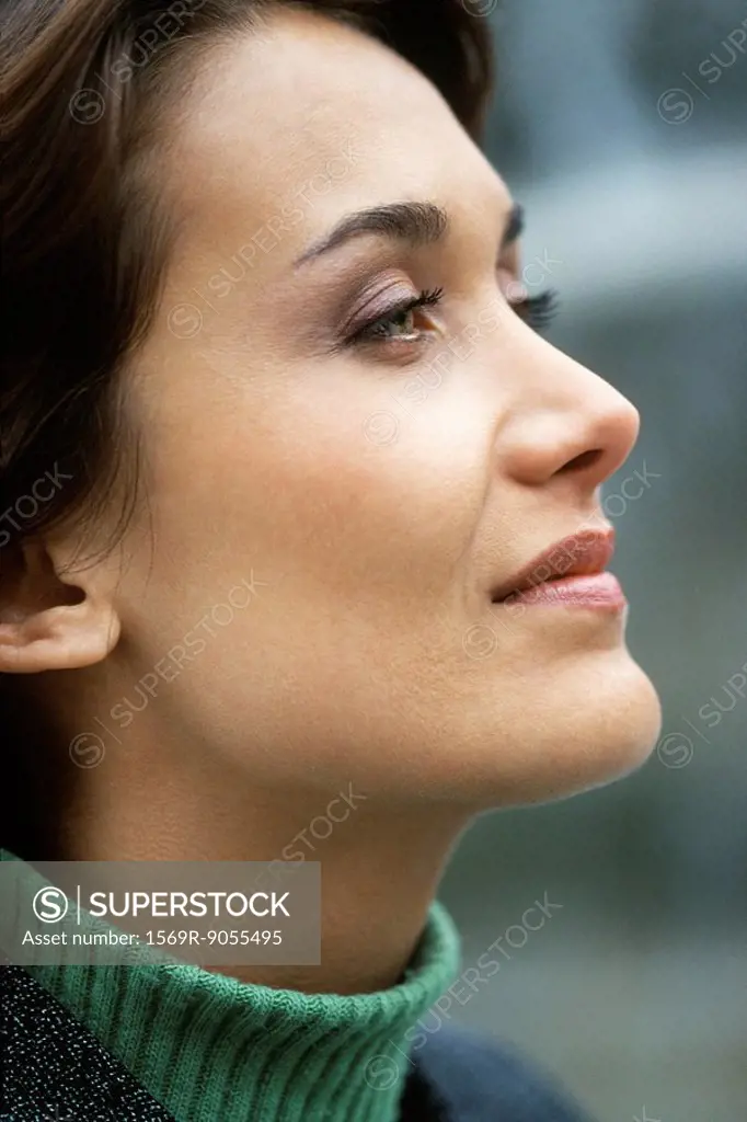 Woman looking away with eye on future aspirations