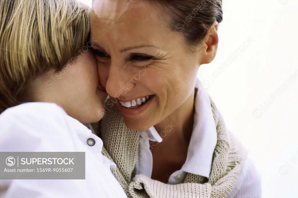 Mother and young son affectionately embracing