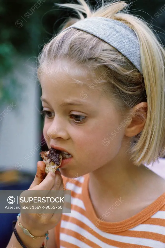 Little girl eating snack