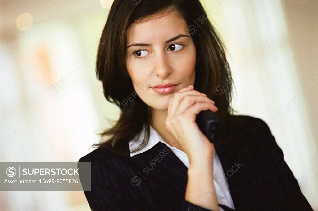 Businesswoman looking away in thought, portrait
