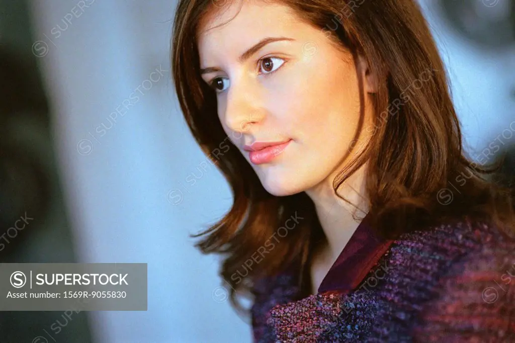 Young businesswoman looking away in thought, portrait