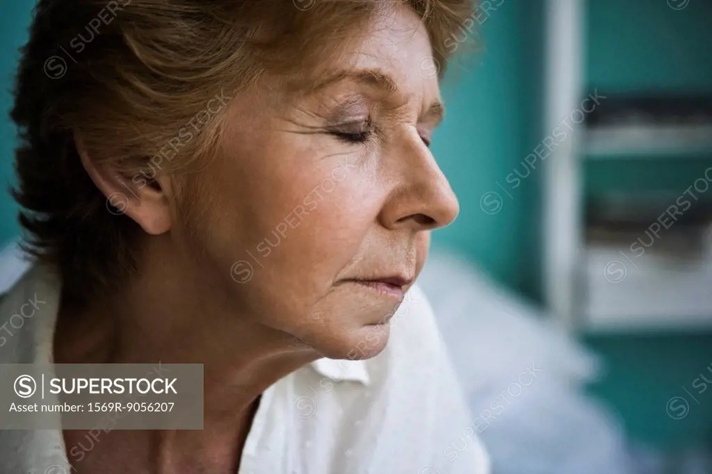 Senior woman with eyes closed