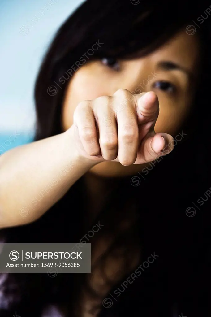 Woman pointing confrontationally at camera