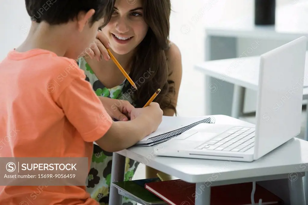 Tutor helping elementary school student