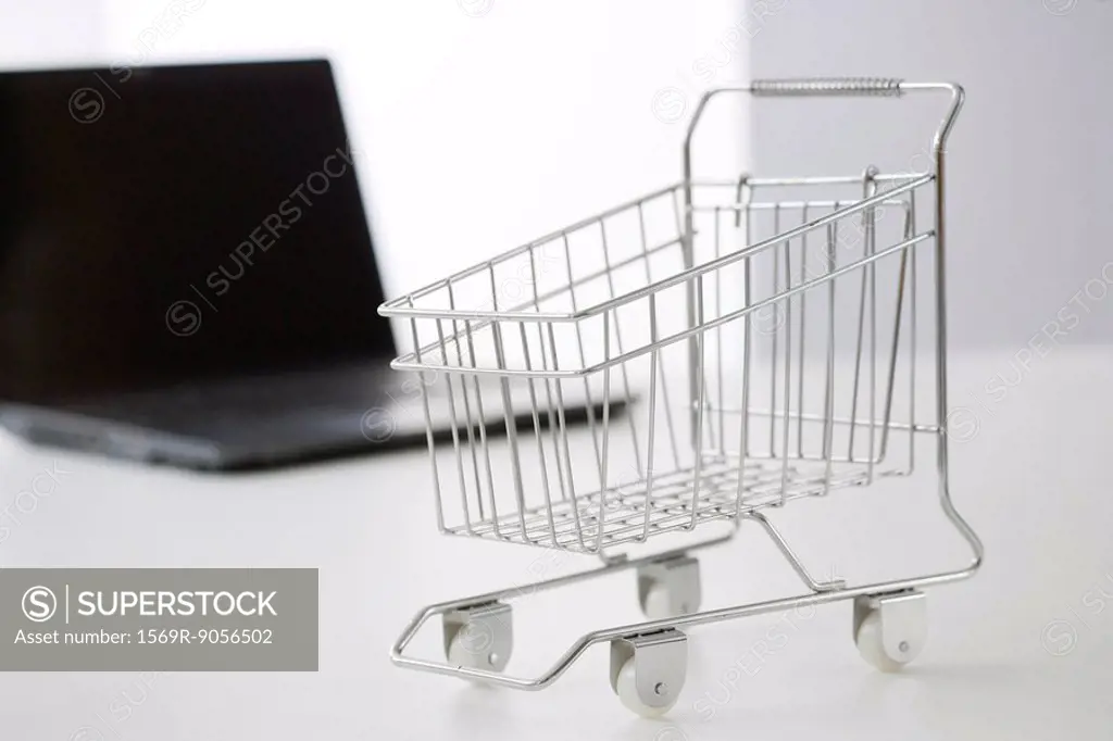 Miniature shopping cart and laptop computer