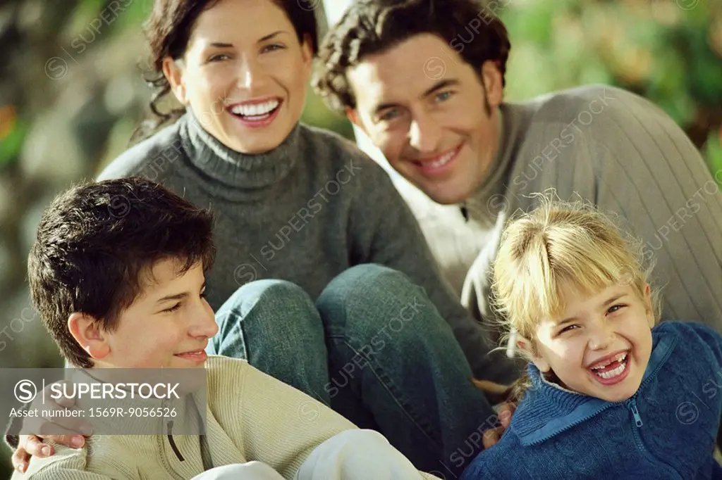 Family laughing together outdoors