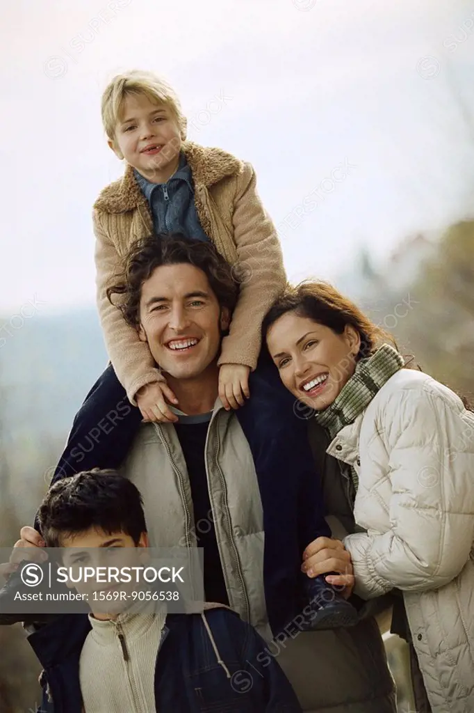 Family together outdoors, portrait