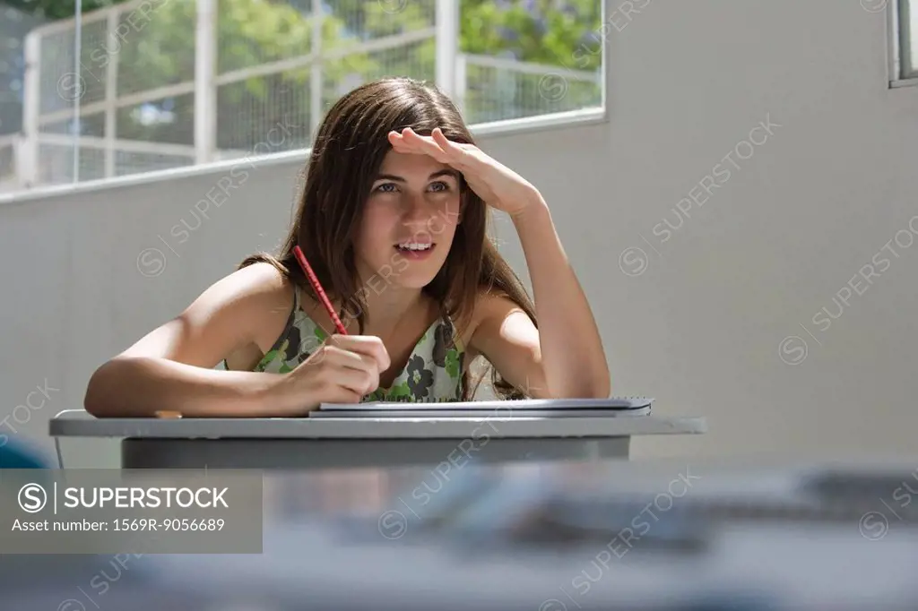Female high school student squinting