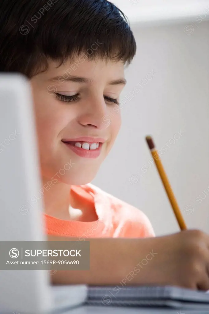 Elementary school student writing classwork