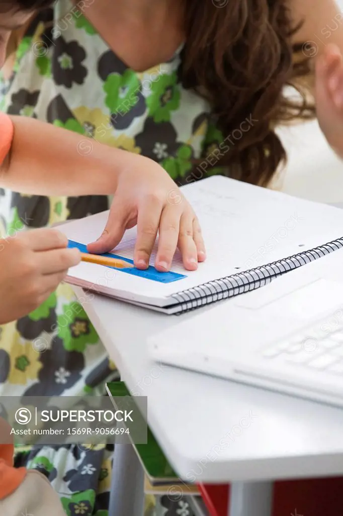 Tutor working with elementary school student