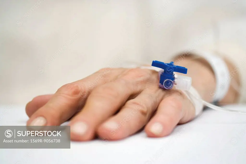 Patient´s hand with IV drip, close_up