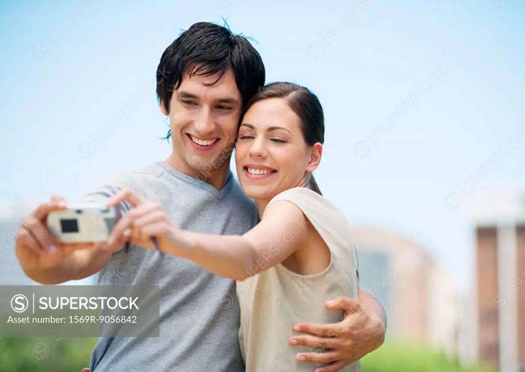 Young couple taking picture of themselves together