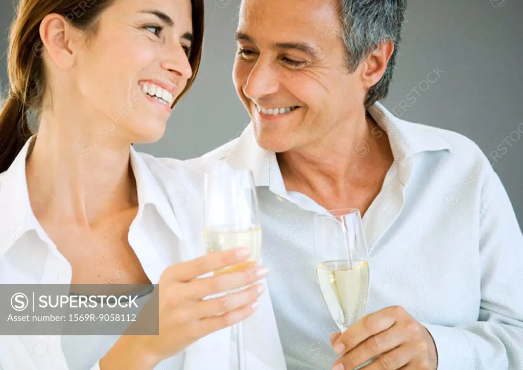 Couple holding champagne flutes