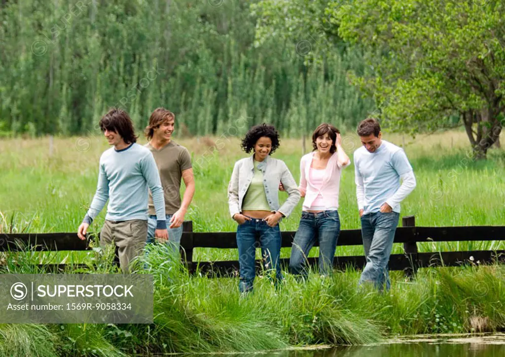 Group of young friends walking outdoors