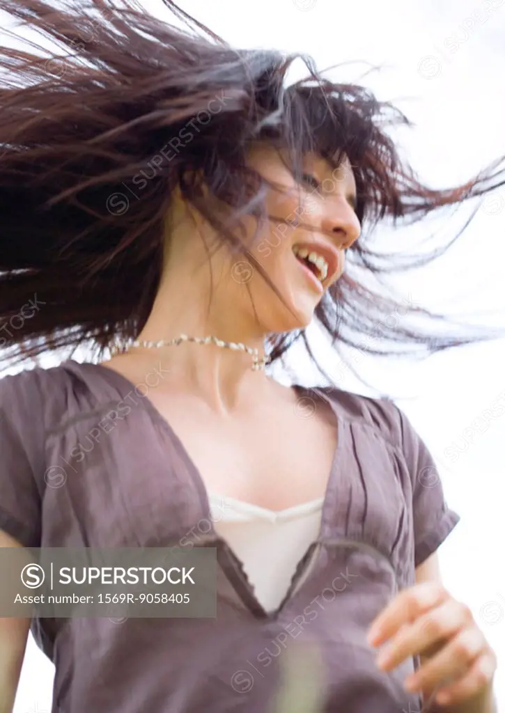 Young woman with hair flying