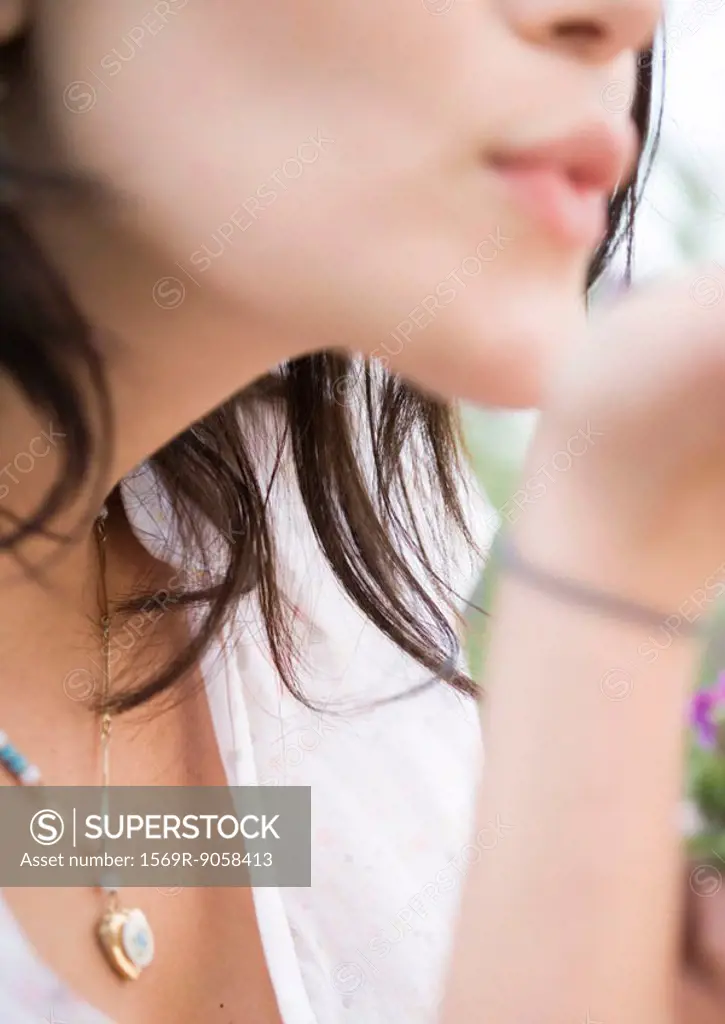 Woman blowing kiss, close-up