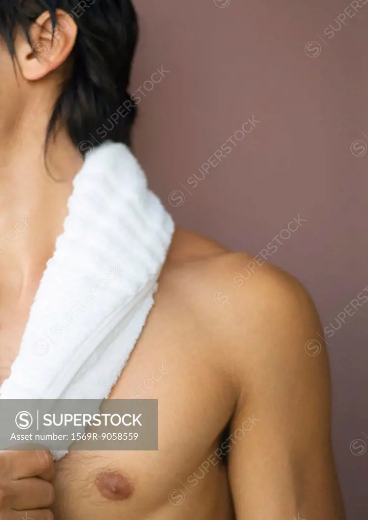 Man´s bare shoulder, towel around neck, cropped