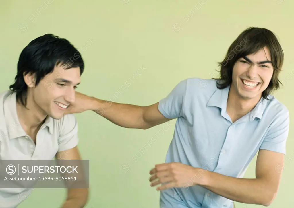 Two young men laughing