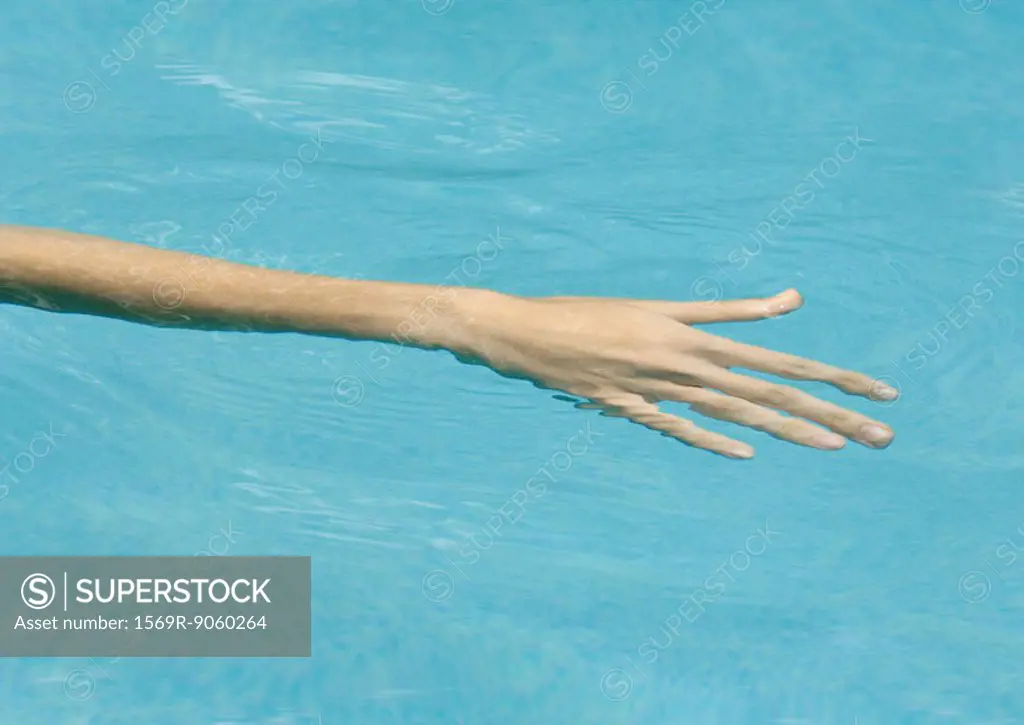 Woman´s arm in water
