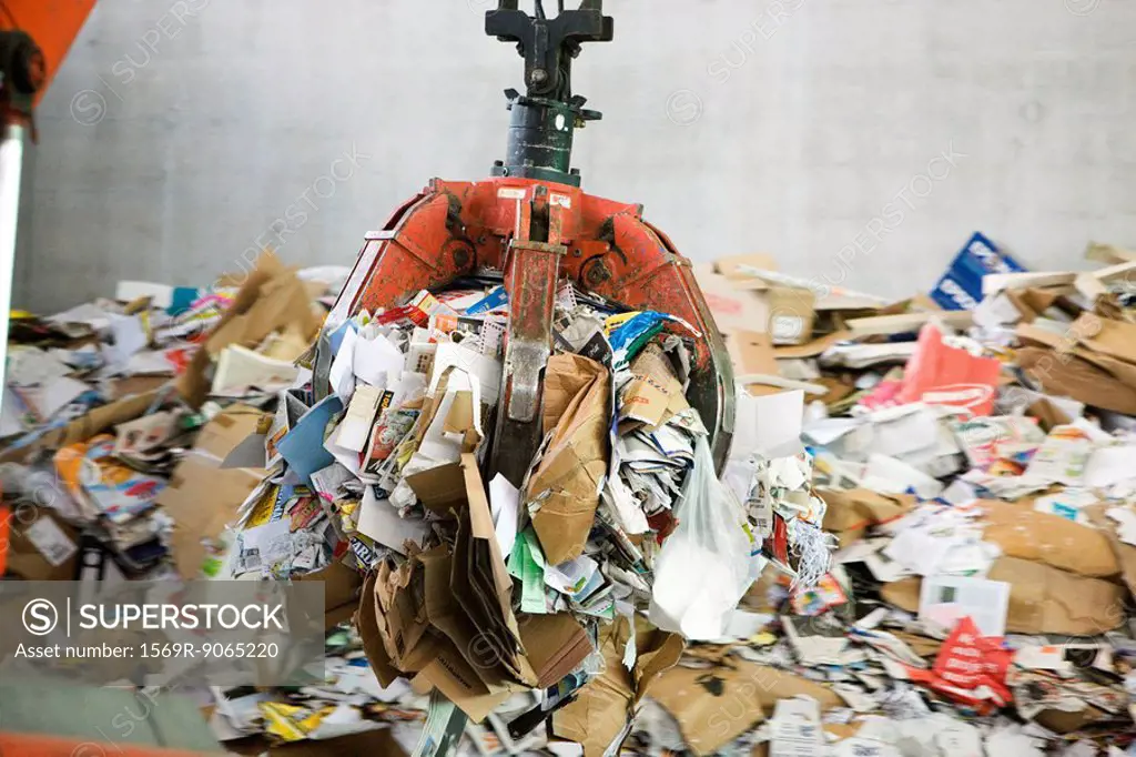 Waste paper being processed in recycling center