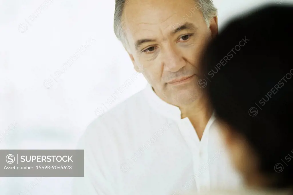 Senior man, looking at wife