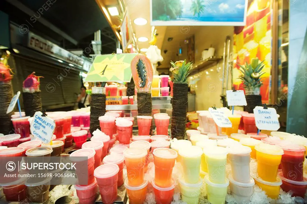 Stacked drinks display at fresh fruit juice shop