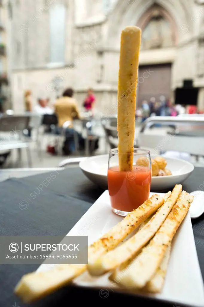 Breadstick dipped in sauce