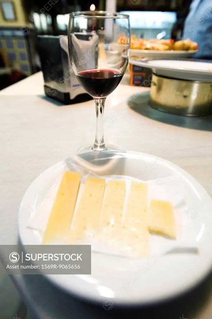 Cheese plate with glass of red wine