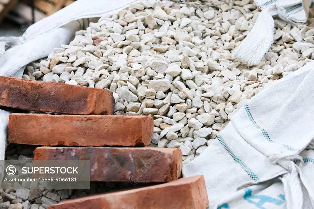 Bricks set on top of sack of gravel