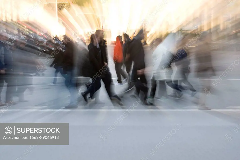 Pedestrians crossing street, blurred