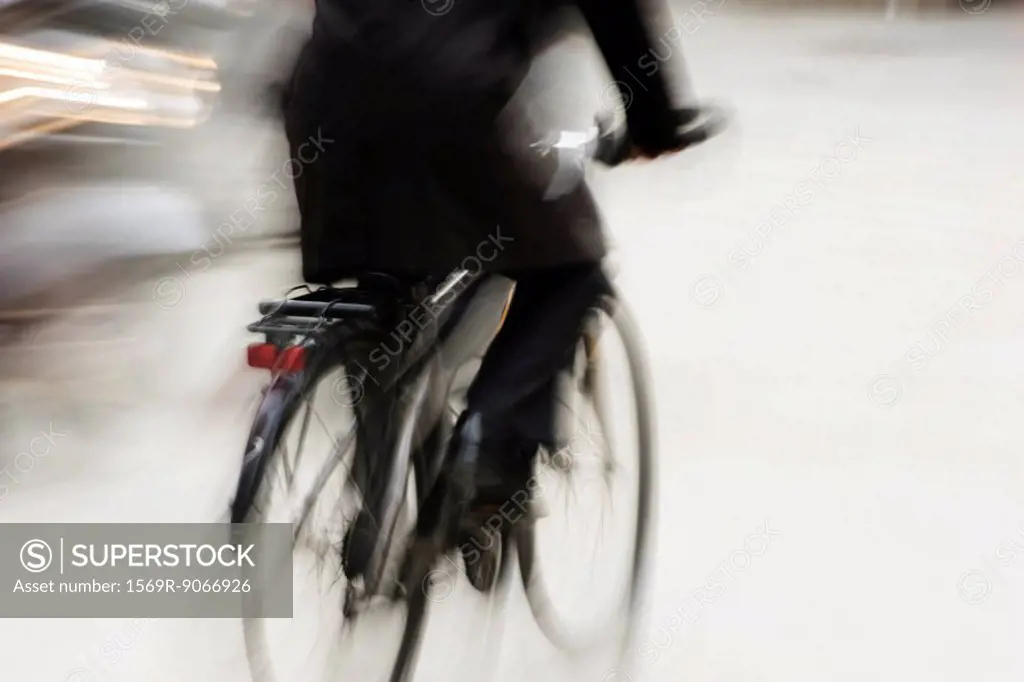 Person riding bicycle, blurred