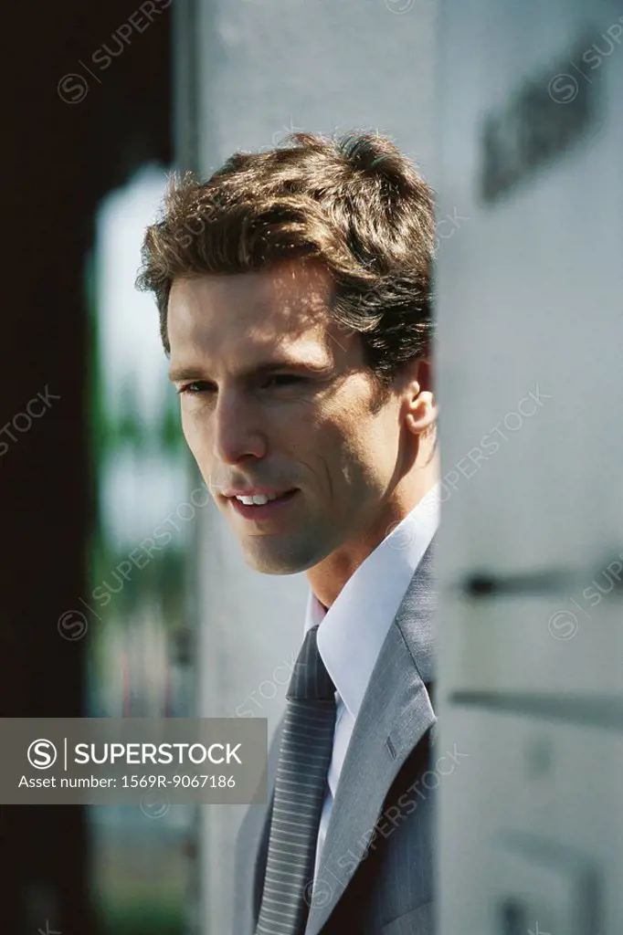 Businessman looking away thoughtfully, portrait