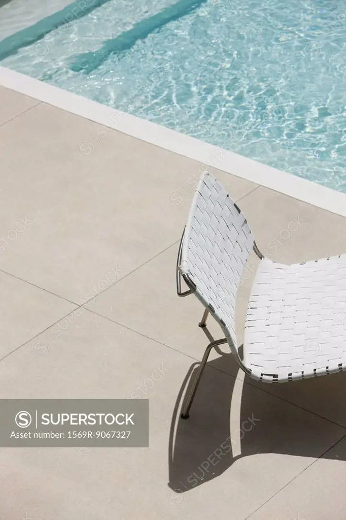 Chair at edge of shallow pool