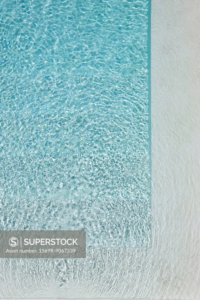 Sunlight refracted on water in swimming pool