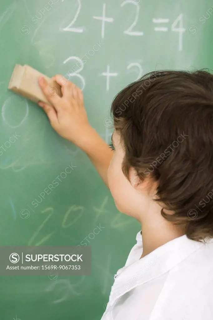 Boy erasing blackboard