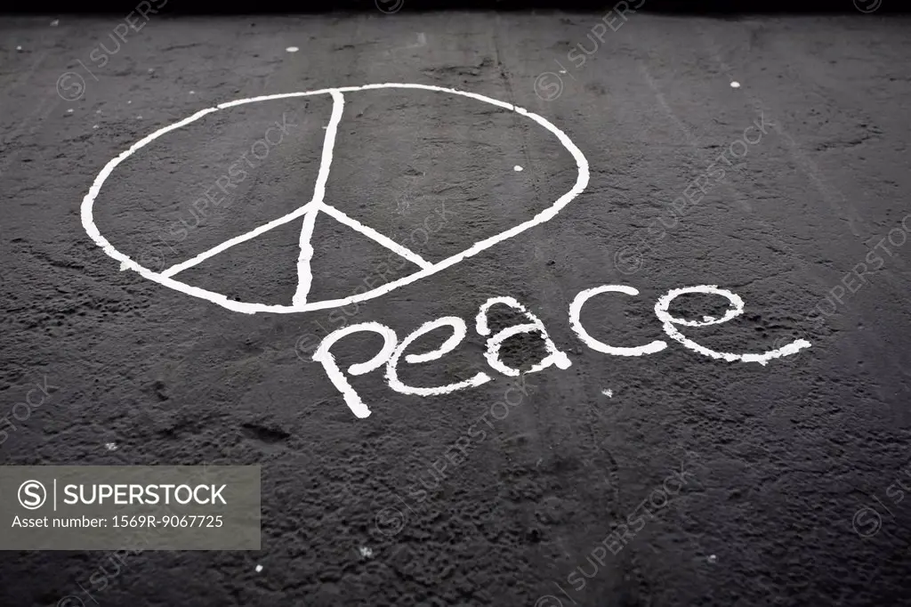 Peace sign and the word peace painted on the Berlin Wall, Berlin, Germany